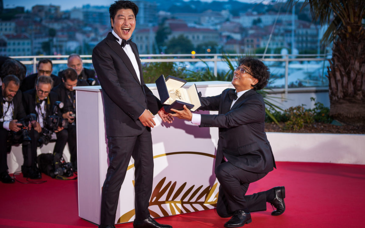 Director Bong Joon-Ho with Kang-Ho Song, winner of the Palme d'Or award for his film "Parasite" poses at the photocall for Palme D'Or Winner - 72 Cannes Film Festival